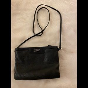 Black crossbody Tumi bag